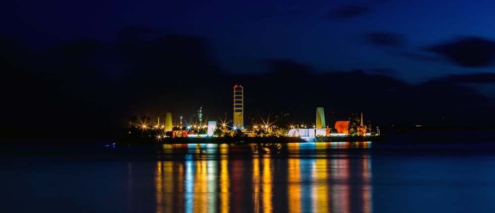 a large body of water with a city in the background