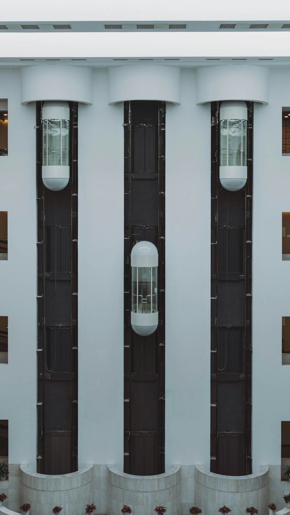 a white building with black doors and windows