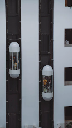 a couple of white speakers sitting next to each other