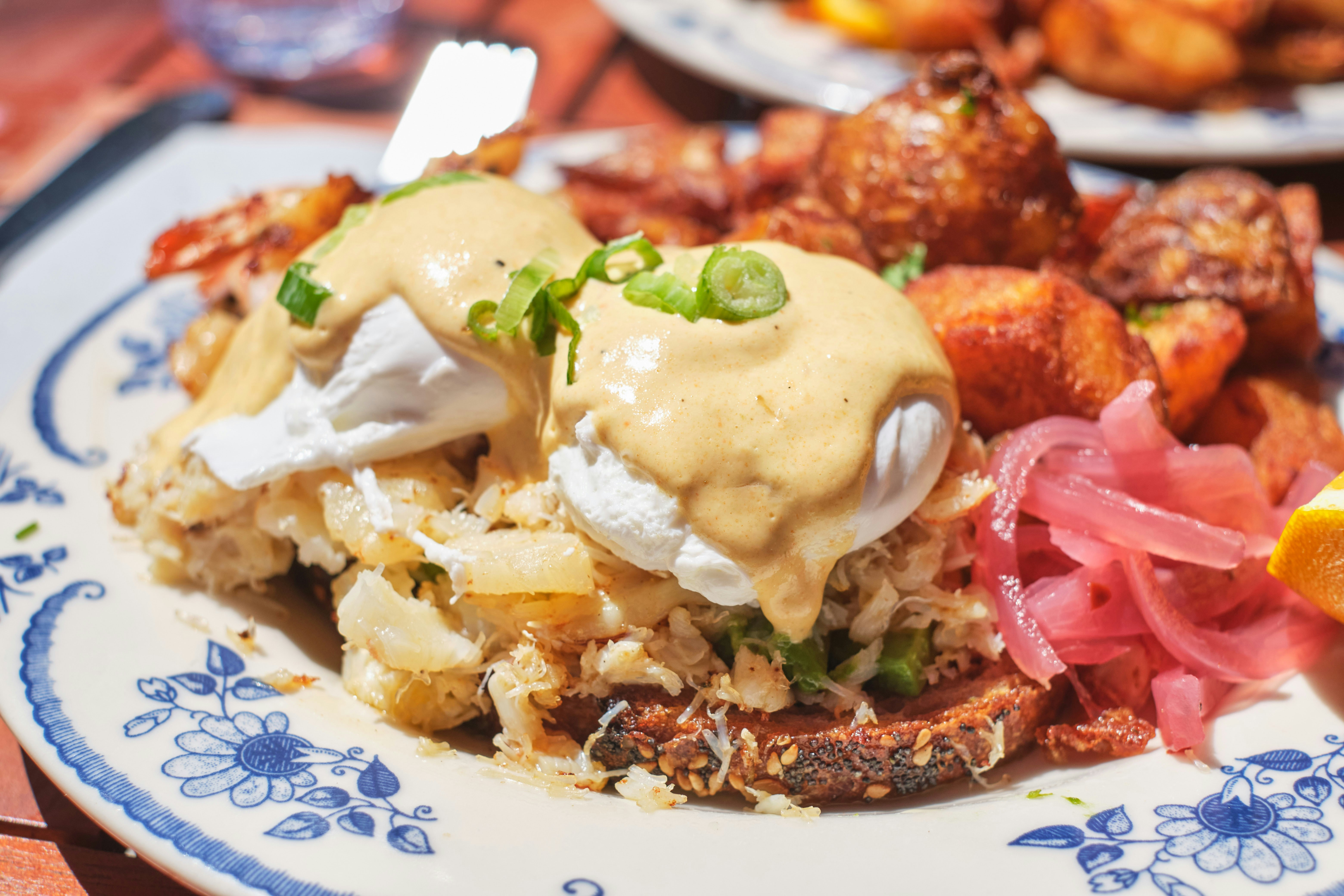 a blue and white plate topped with food