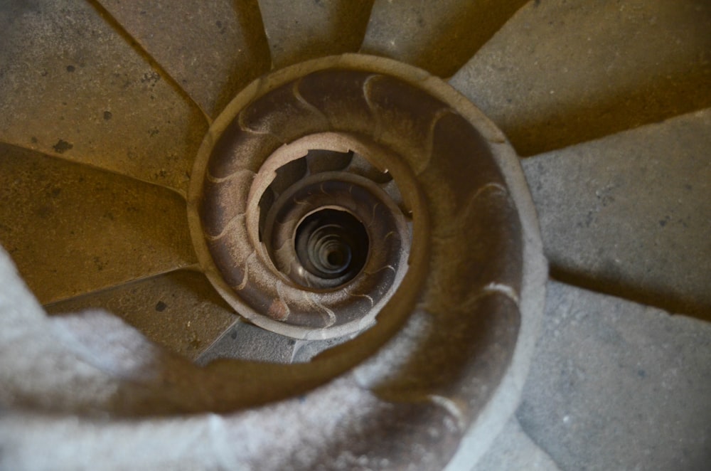 a spiral staircase made of concrete with a spiral design