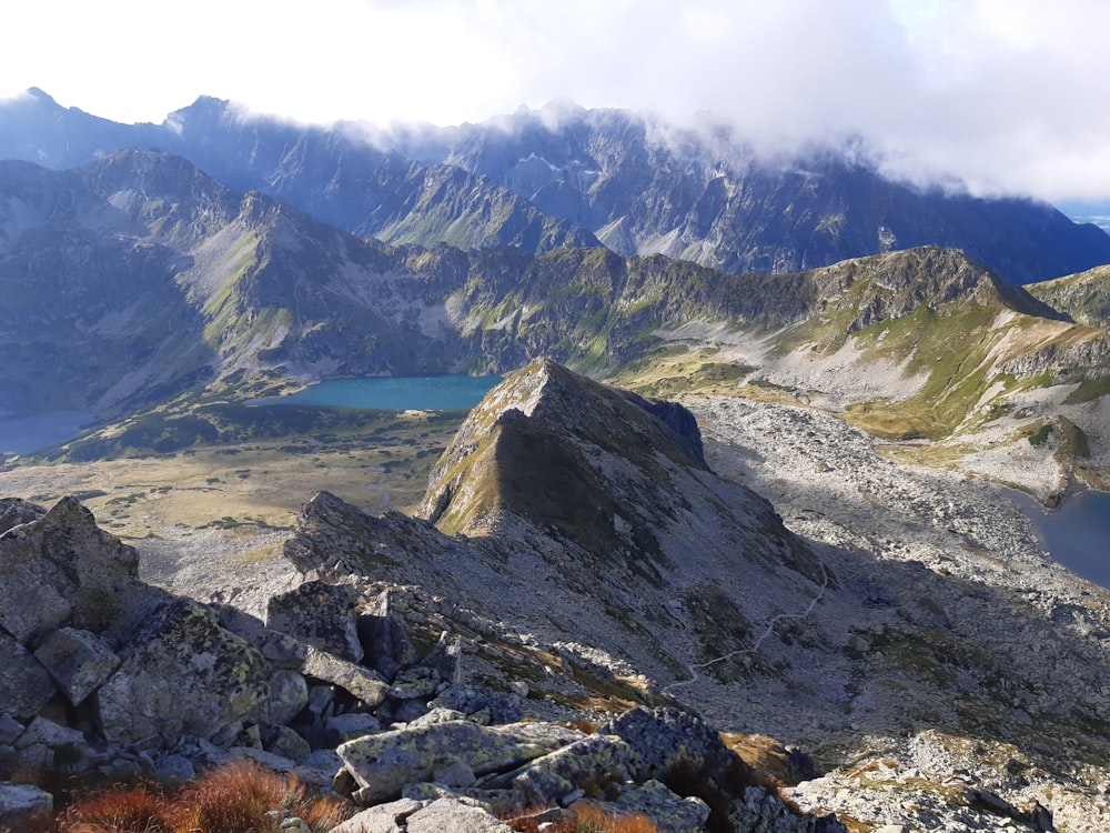 a view of a mountain range with a lake in the middle