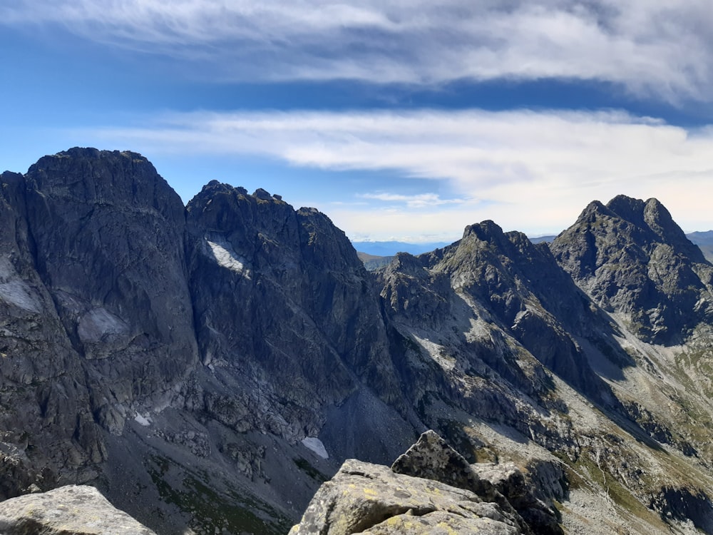 a view of a mountain range from the top of a mountain