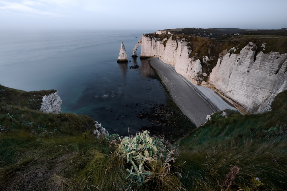 a large body of water surrounded by tall white cliffs