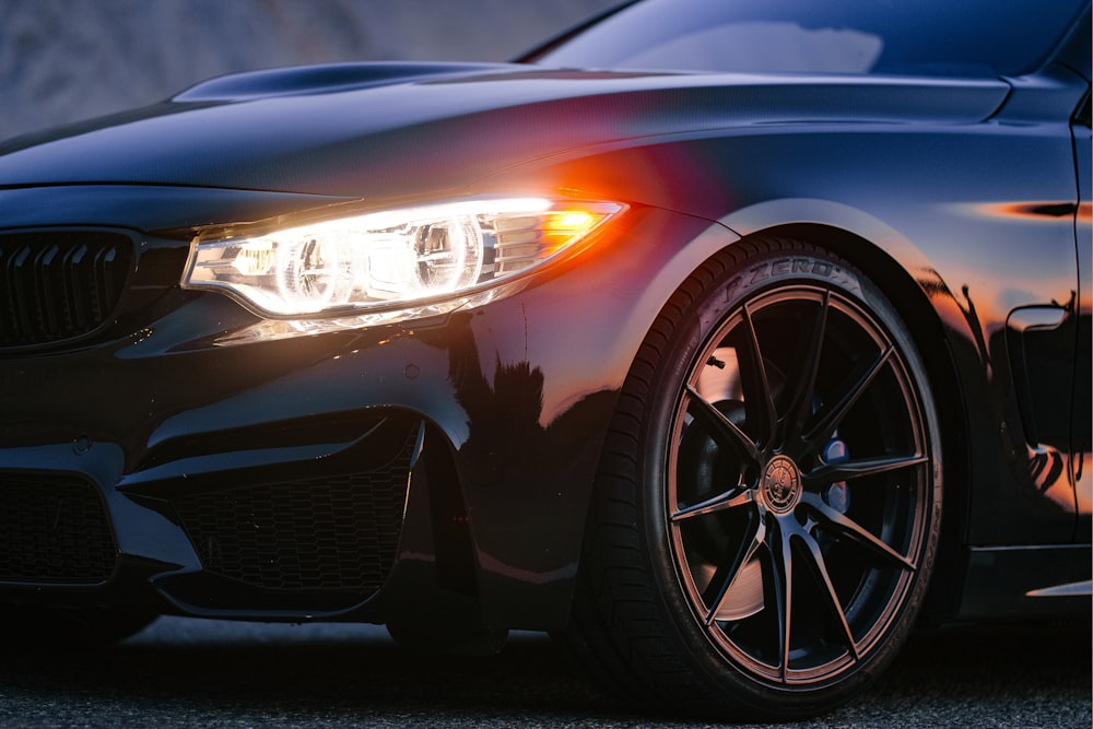 a close up of the front of a black car