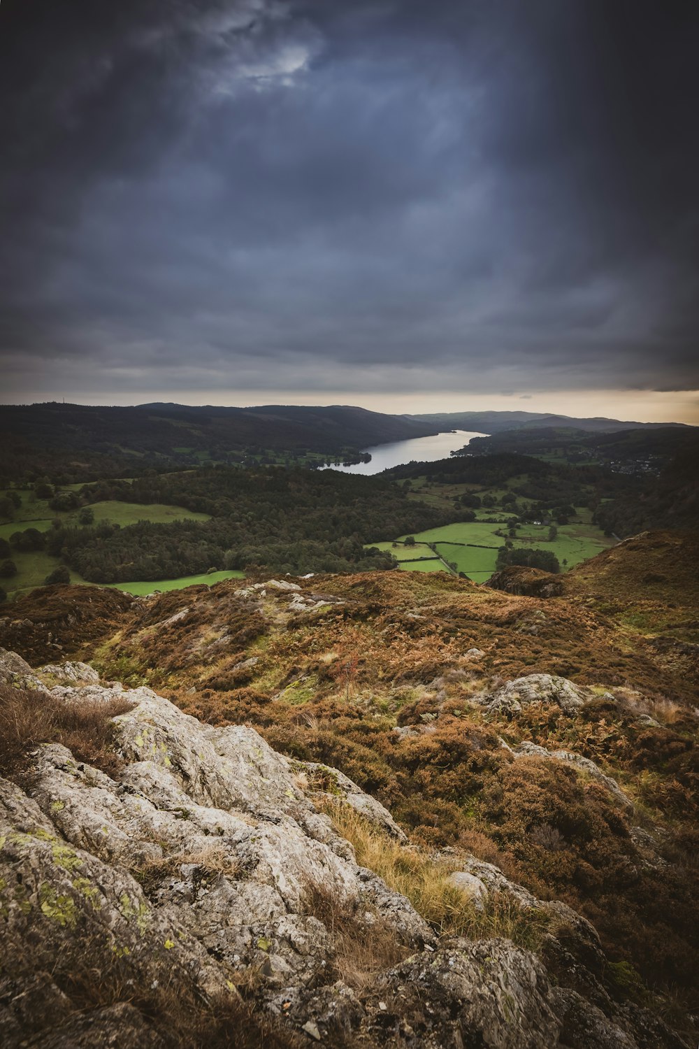 a view of a lake from the top of a hill