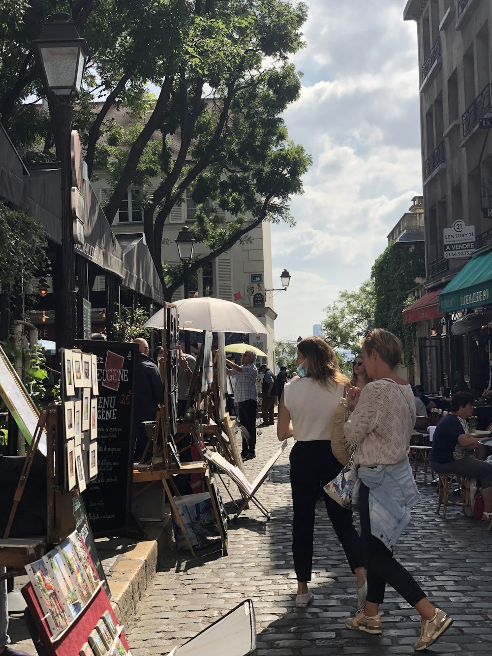 a group of people walking down a street