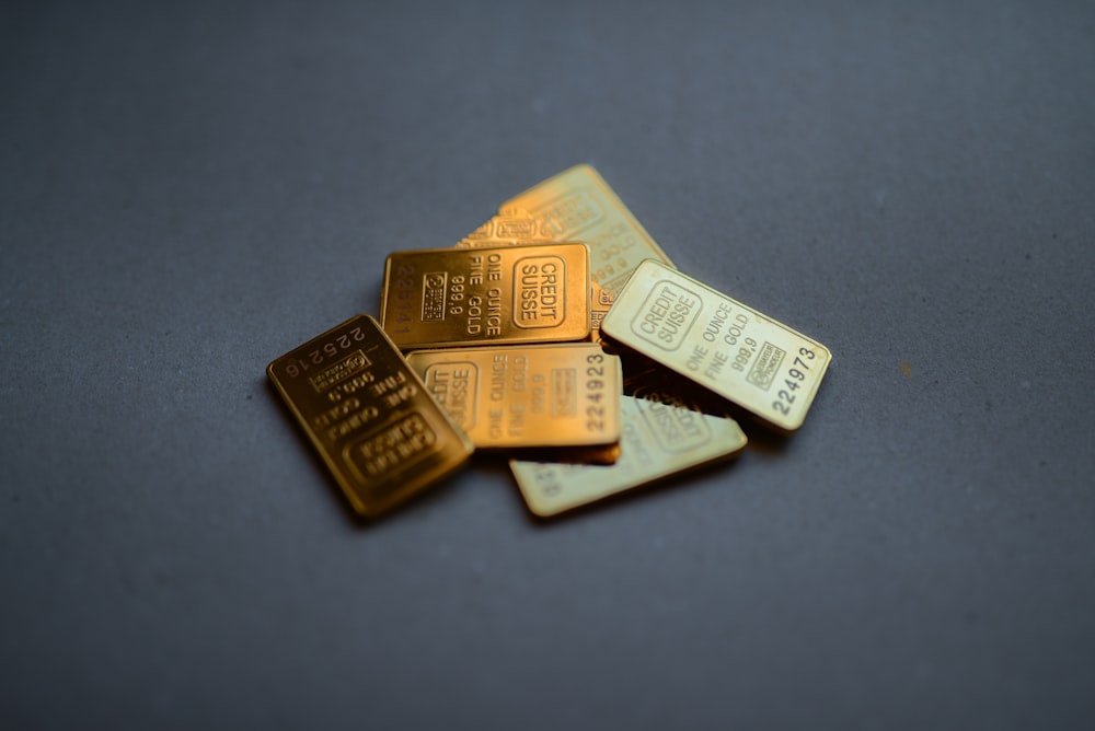 a pile of gold bars sitting on top of a table