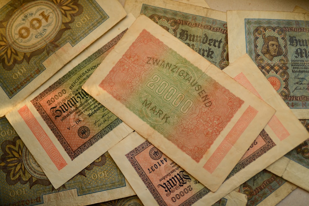 a pile of old money sitting on top of each other