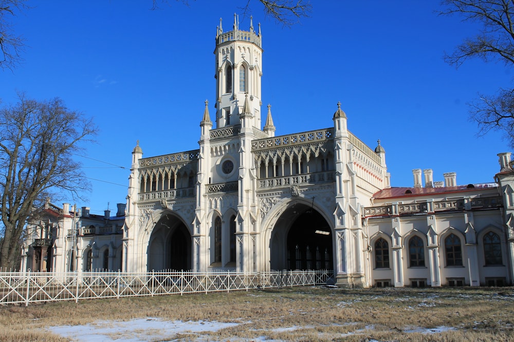 a large white building with a clock tower