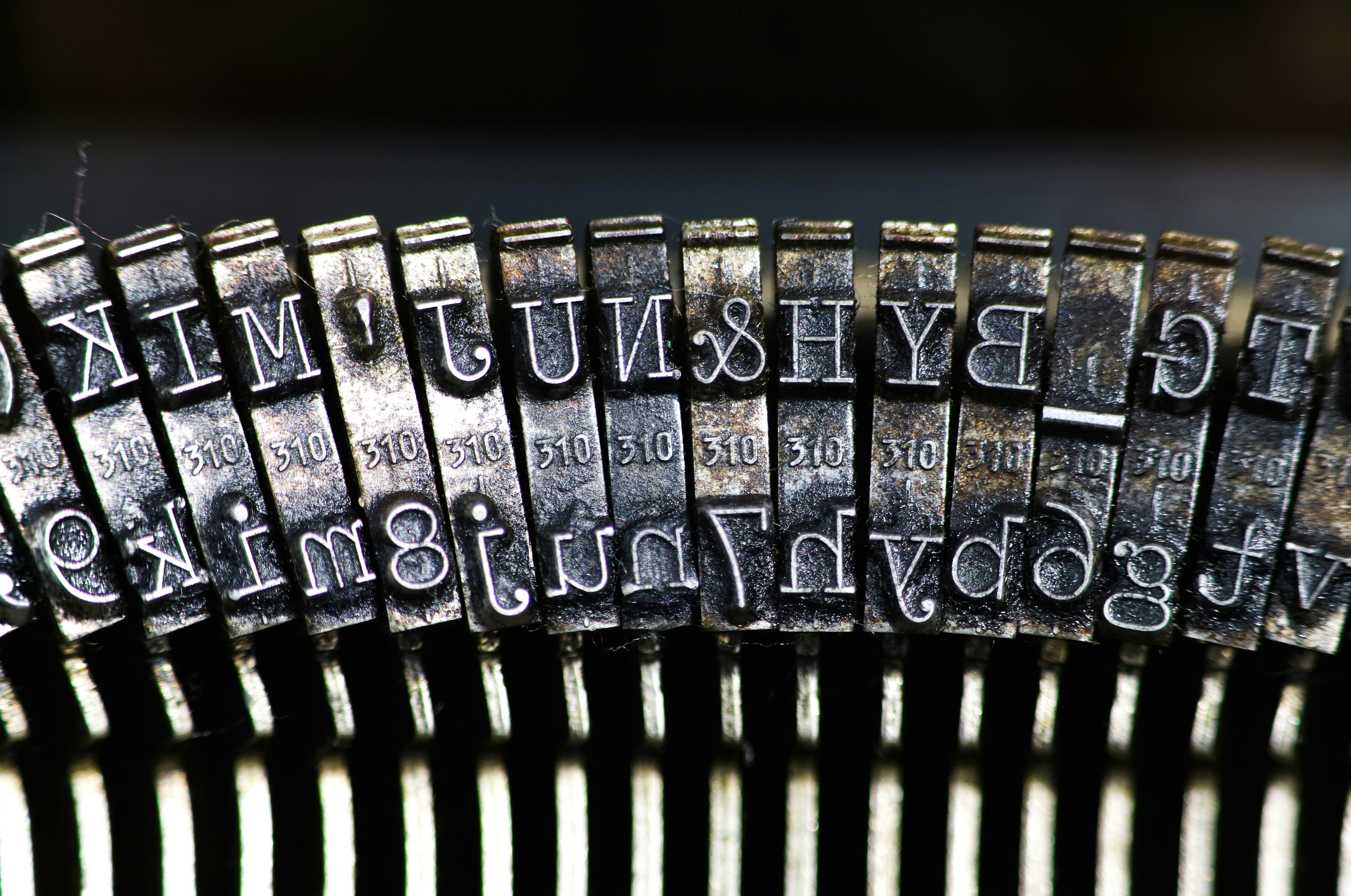 Close up of old and dirty typewriter letters that have not been used for a long time