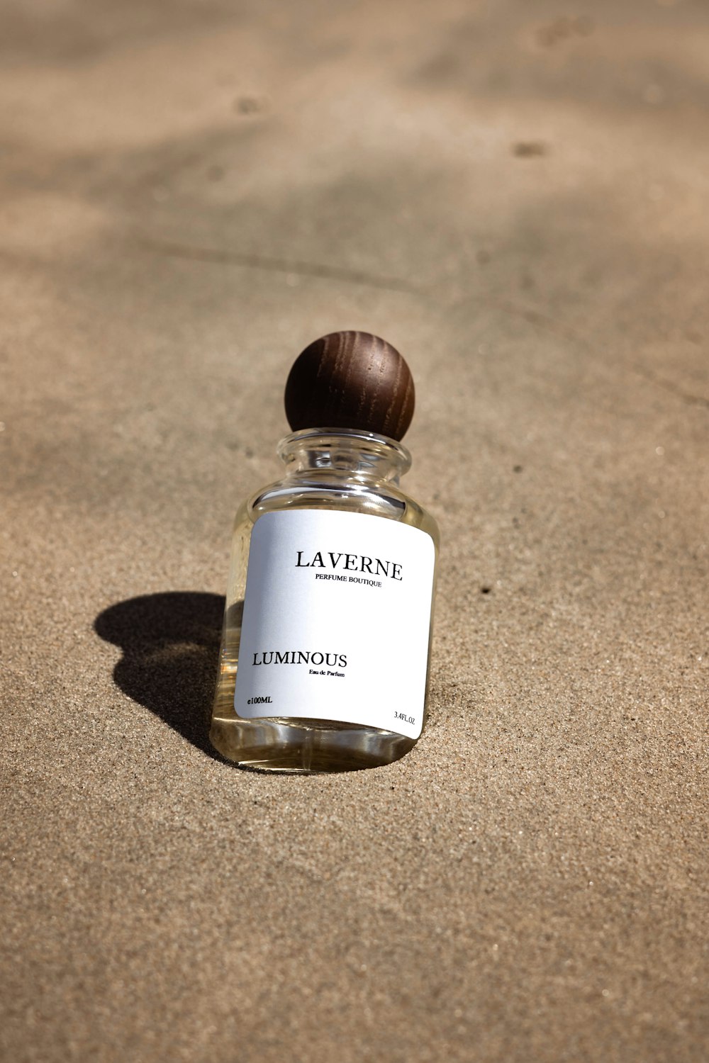 a bottle of lavender sitting on the ground