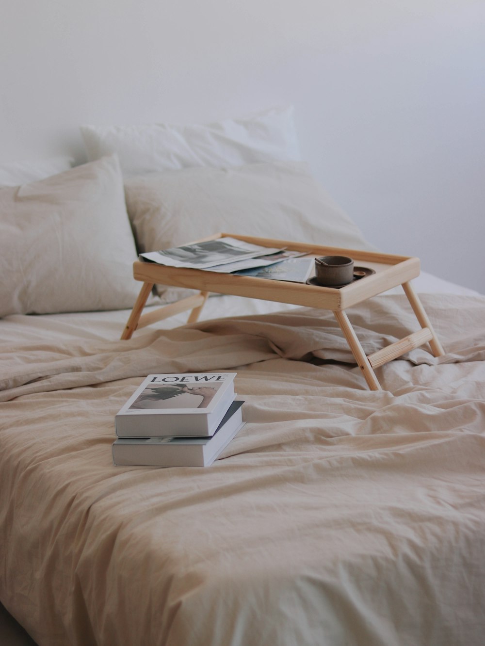 a bed with a tray on top of it