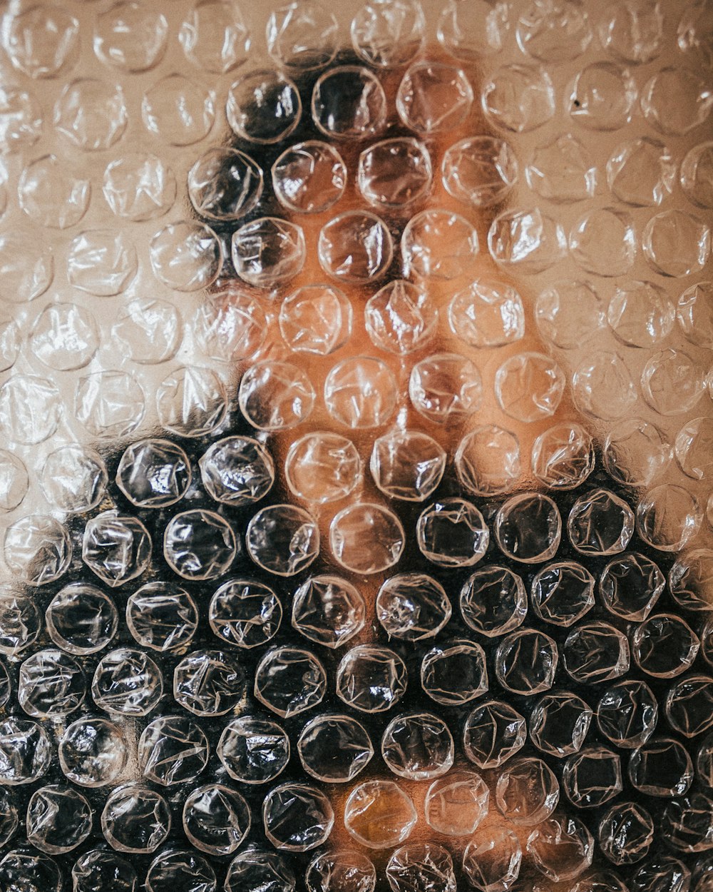 a woman's face is covered in bubbles of water