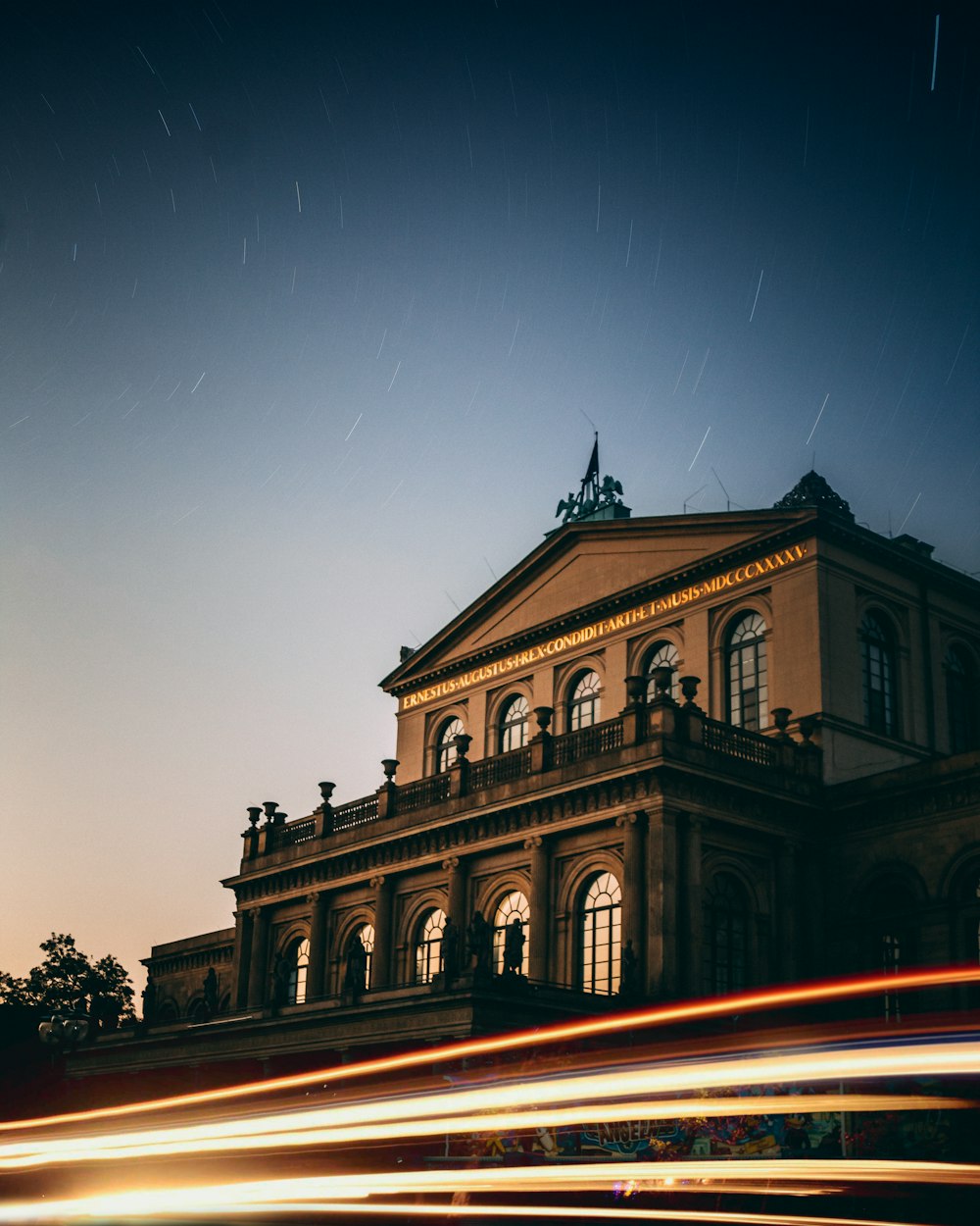 a long exposure of a building with a sky background