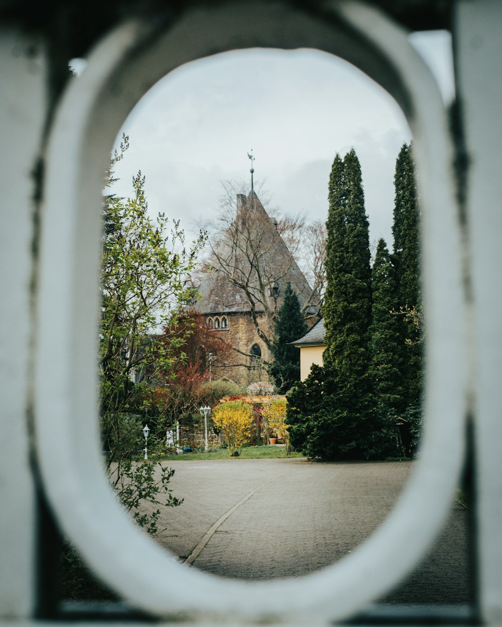 a view of a church through a circular window