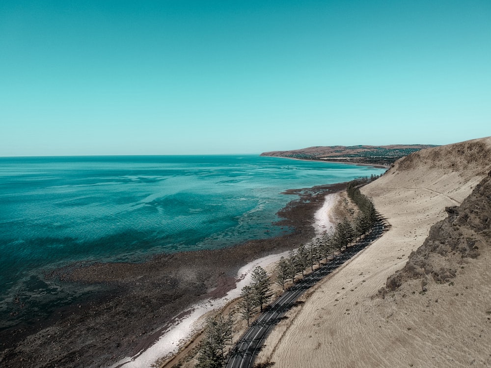 an aerial view of a beach and a body of water