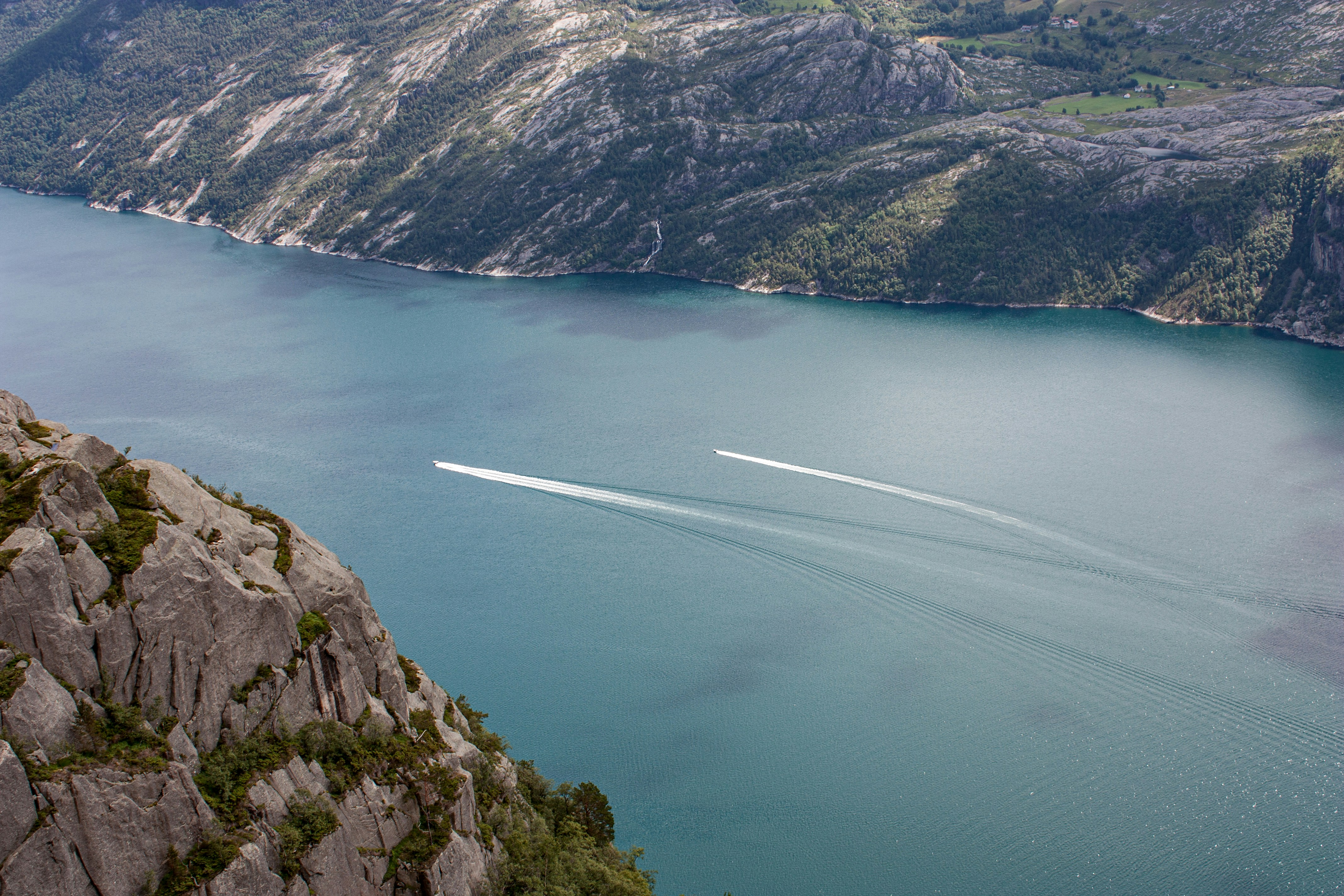 a boat is in the middle of a large body of water, 