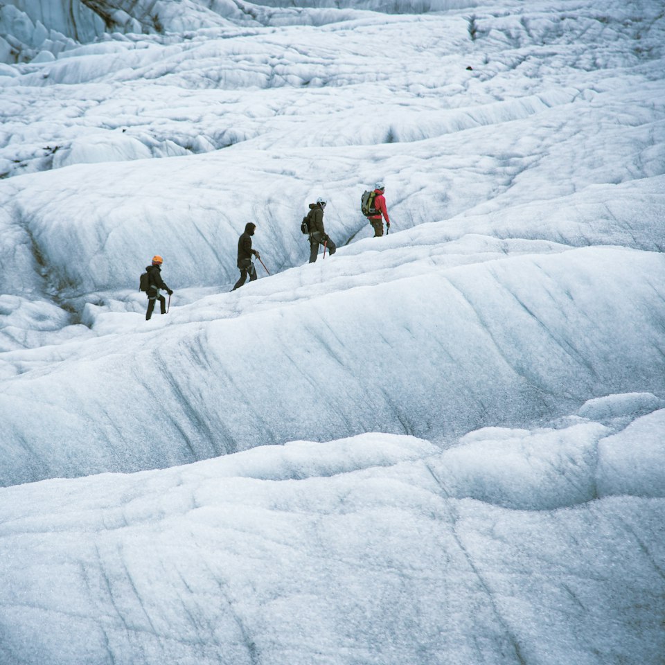 A guided group glacier hiking with crampons across Svinafellsjokull, an outlet glacier of Vatnajokull, Iceland