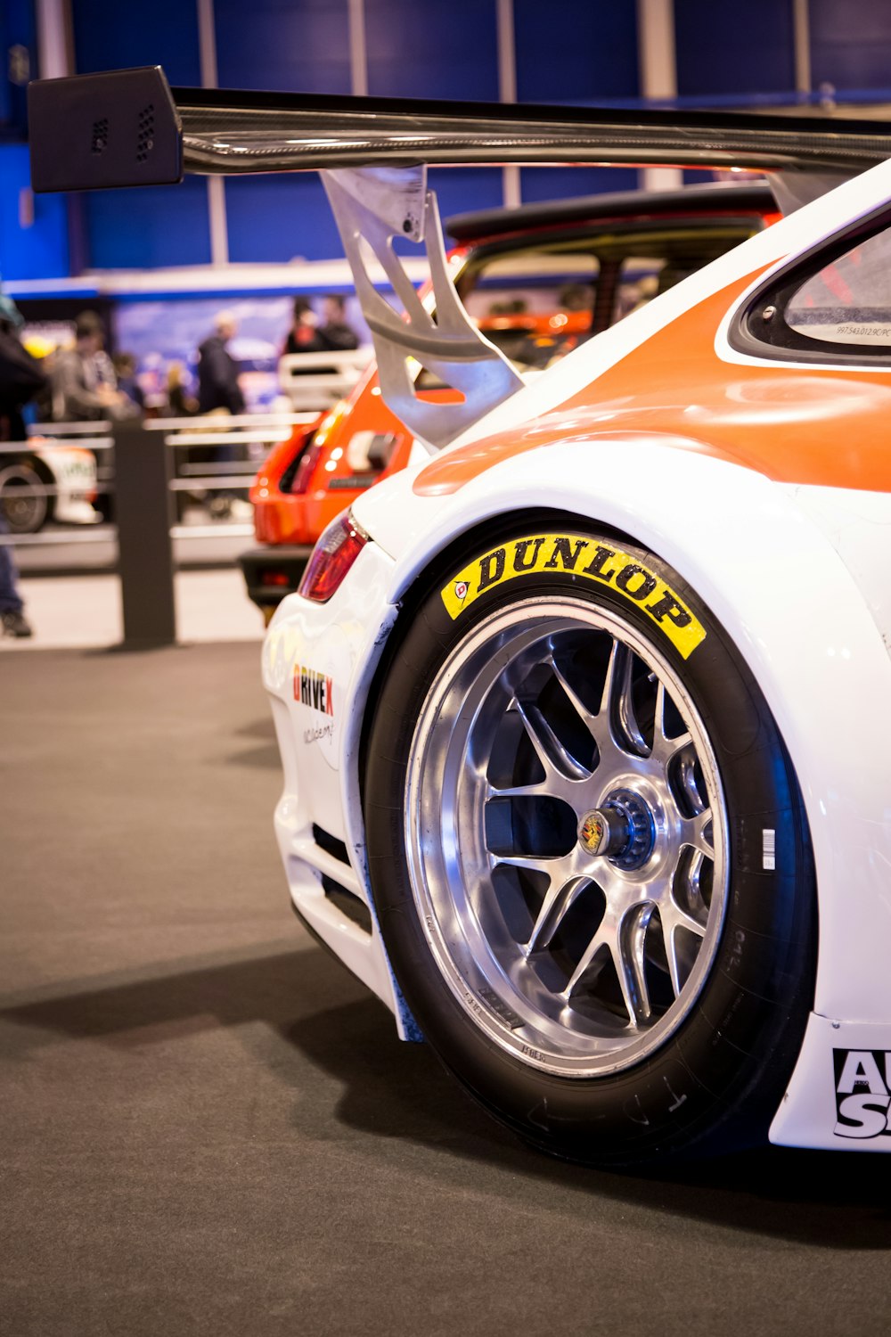 a close up of a car on display at a car show