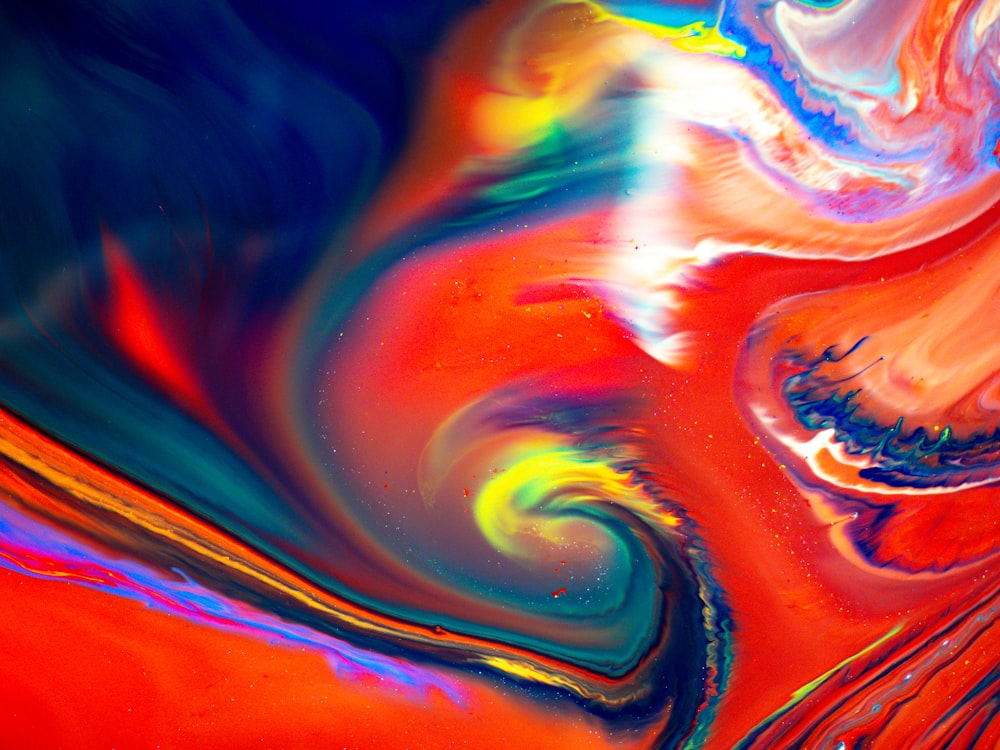 an abstract painting of a red, orange, and blue swirl