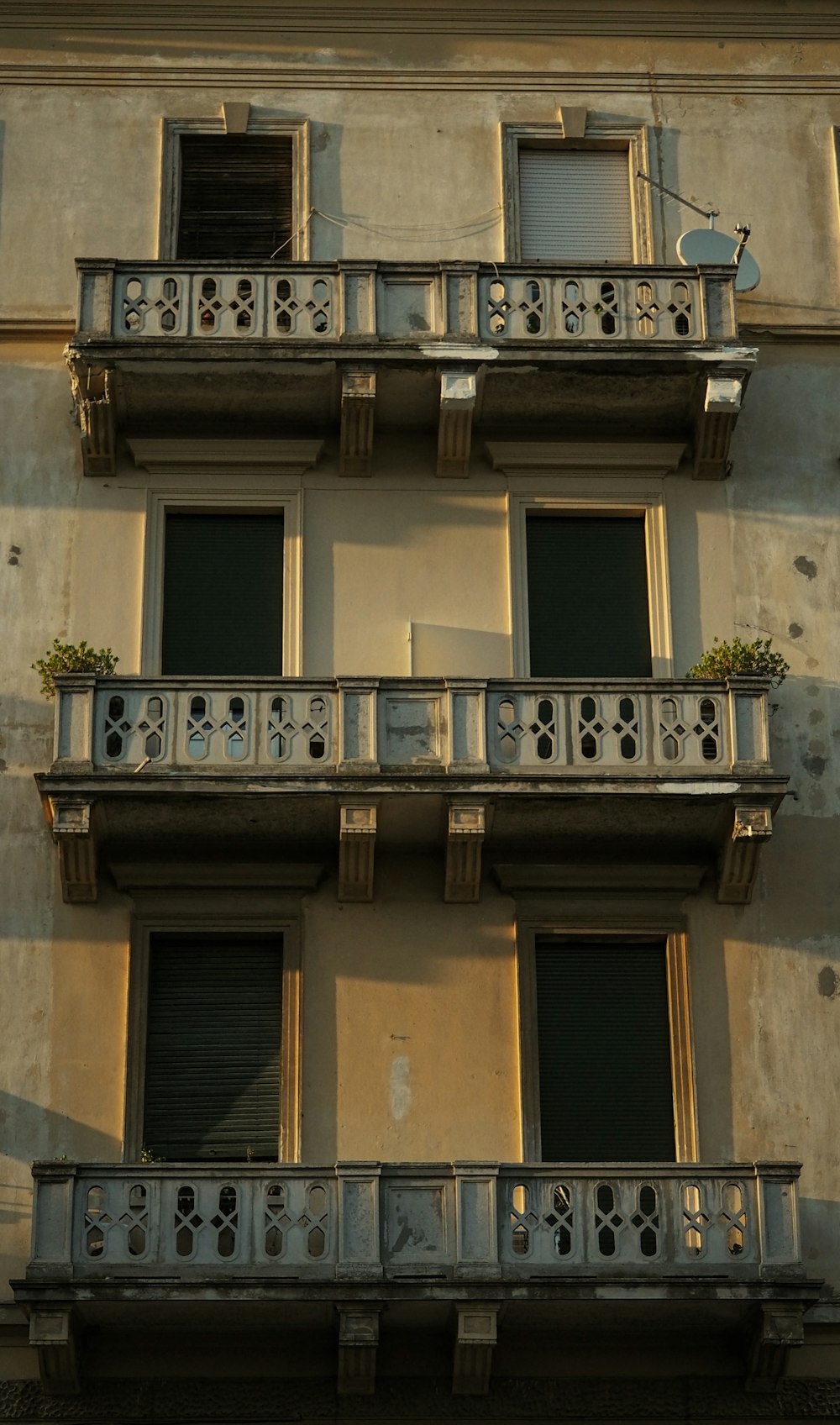 a building with balconies and a clock on it