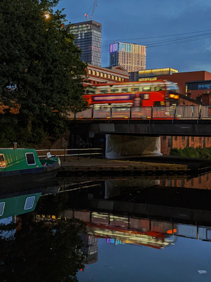 a train traveling over a bridge over a river