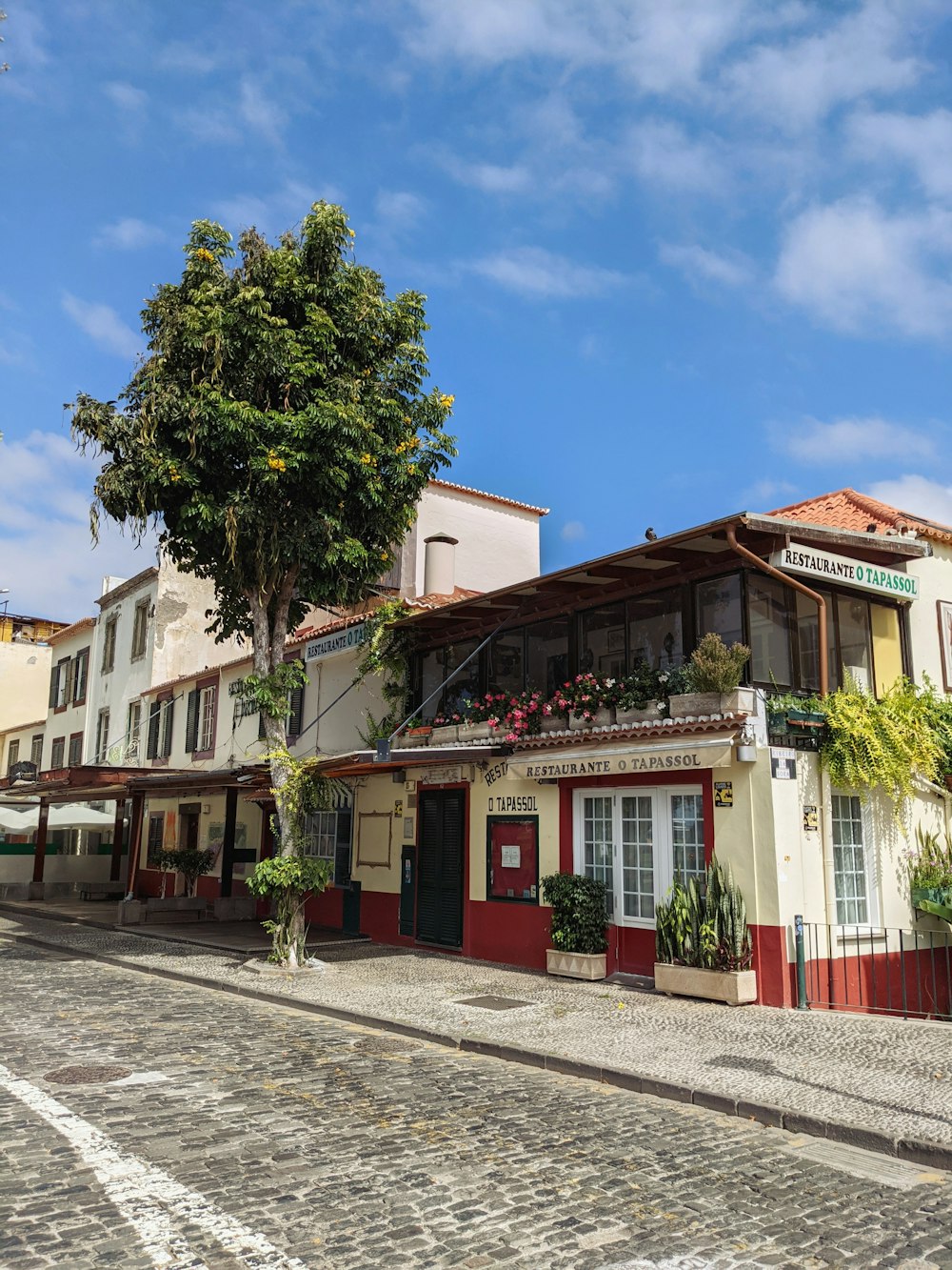 a cobblestone street in a small town