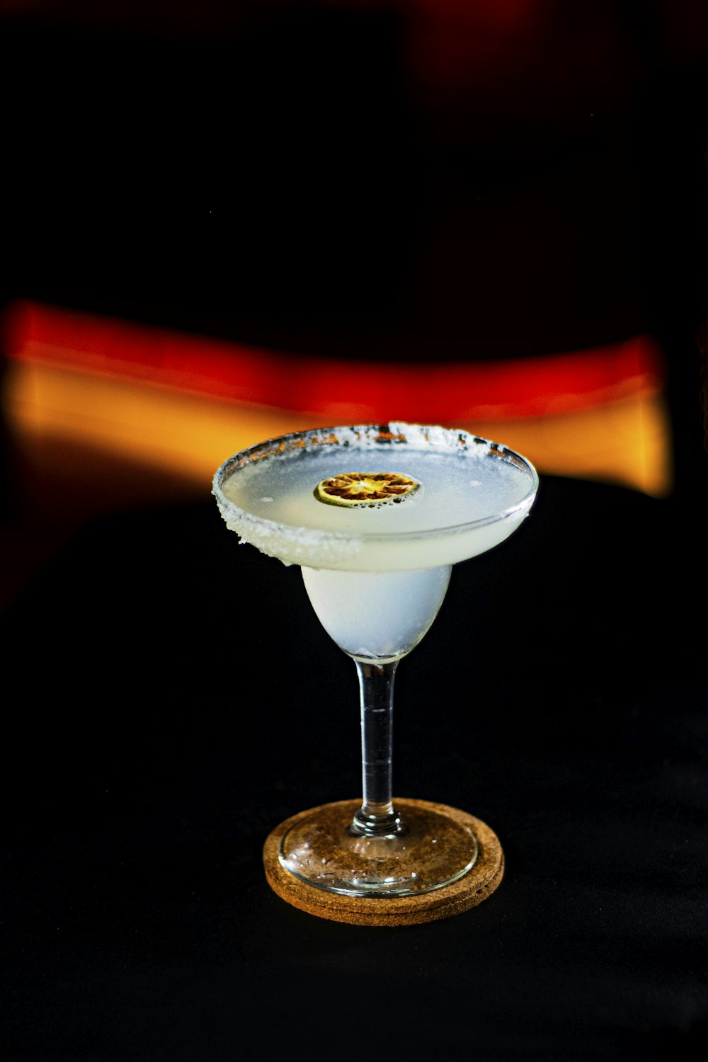 a white cocktail sitting on top of a table