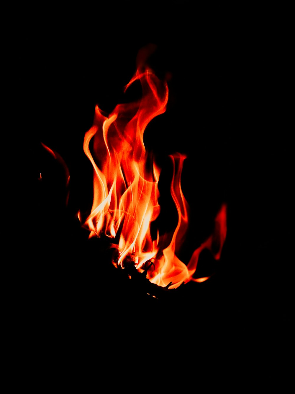 a close up of a fire on a black background