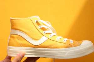 Yellow runner held in hand