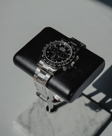 Beverly Hills Polo Club watch with a classic design, placed on a black velvet cushion.