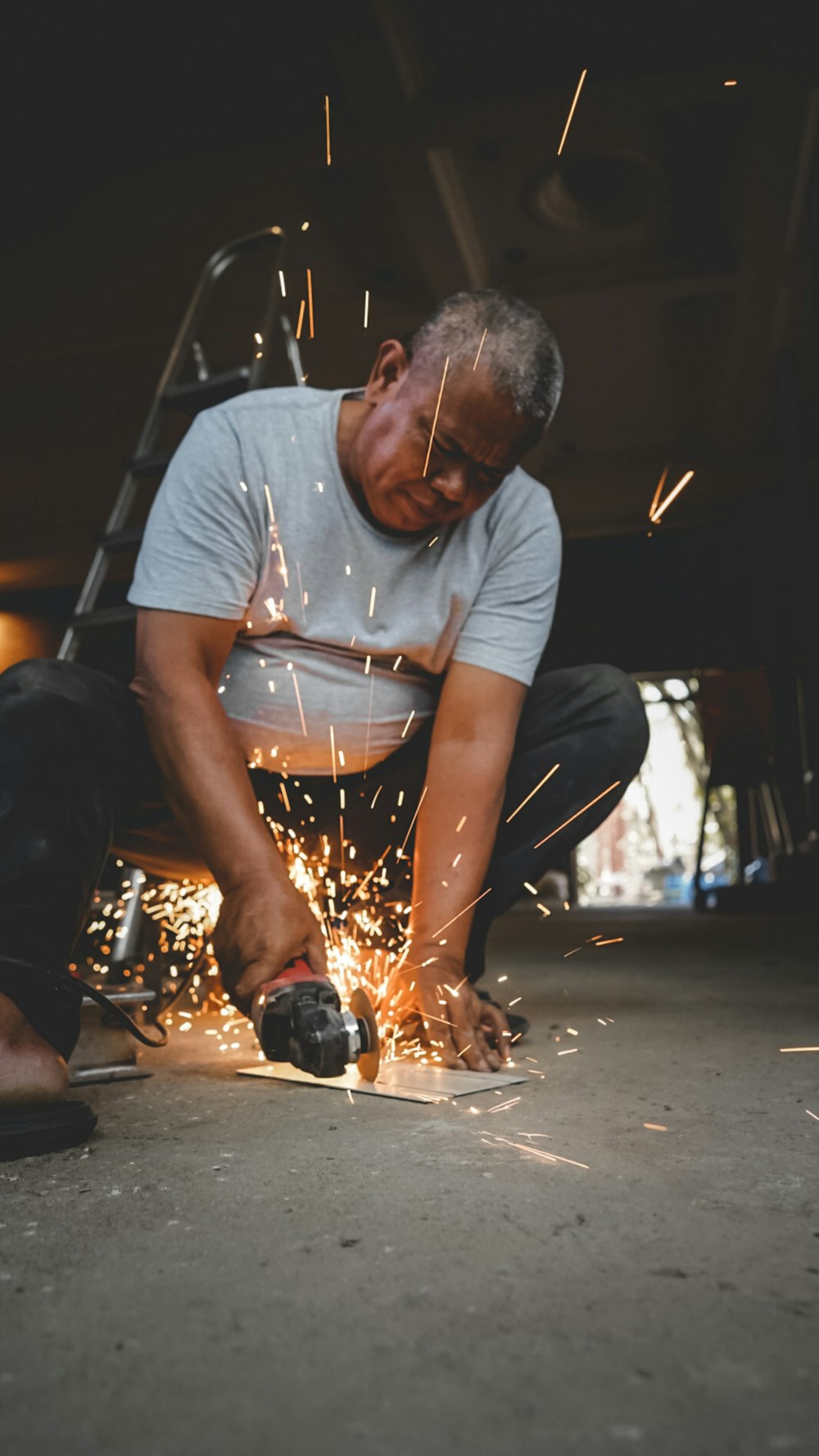 a man working on a piece of metal