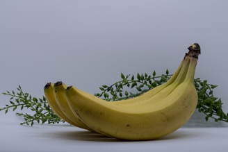 Close-up of ripe Indian bananas arranged with the Indian tricolor in the background.