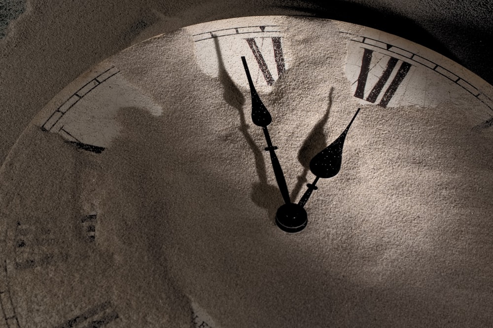 a close up of a clock with roman numerals