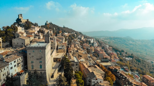 A scenic landscape featuring a historic town with traditional architecture.