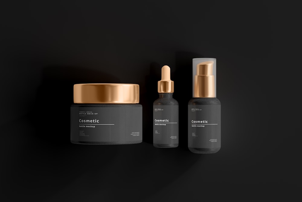 two bottles of cosmetic products on a black background