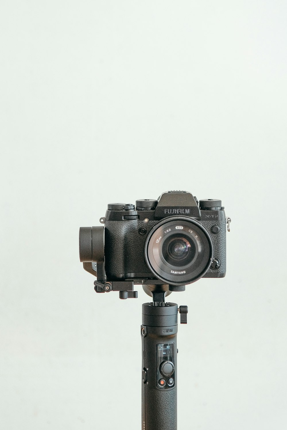 a camera sitting on top of a tripod