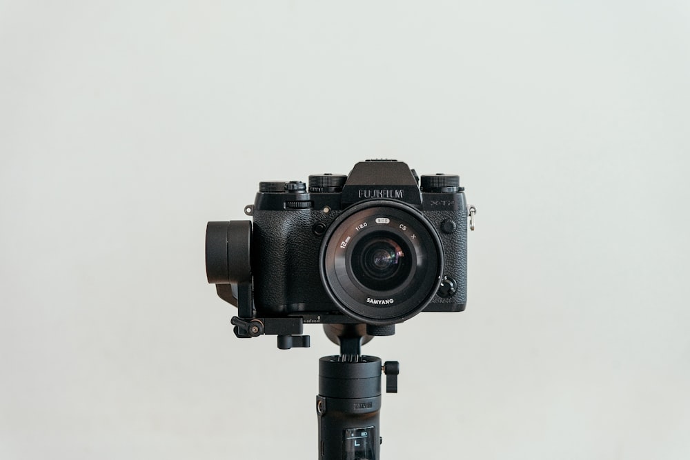 a camera sitting on top of a tripod