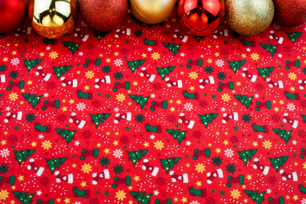 a group of christmas ornaments on a red background
