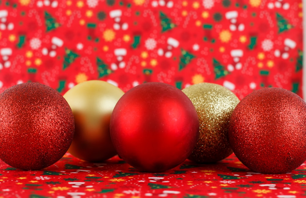a row of red and gold christmas ornaments