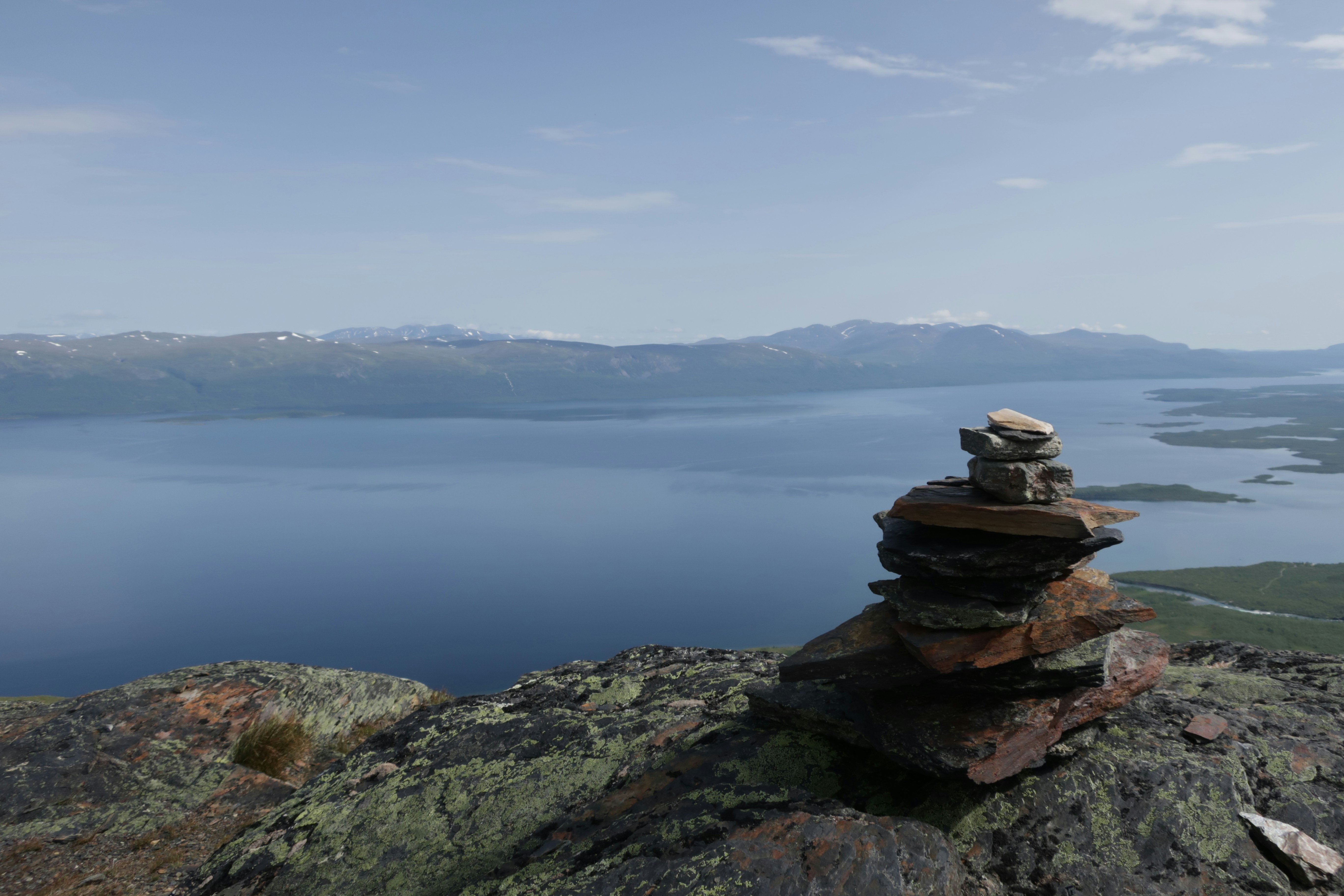 A stack of rocks sitting on top of a mountain photo – Free Nuolja Image ...