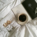 Set of coffee bean earrings arranged on a vintage book.