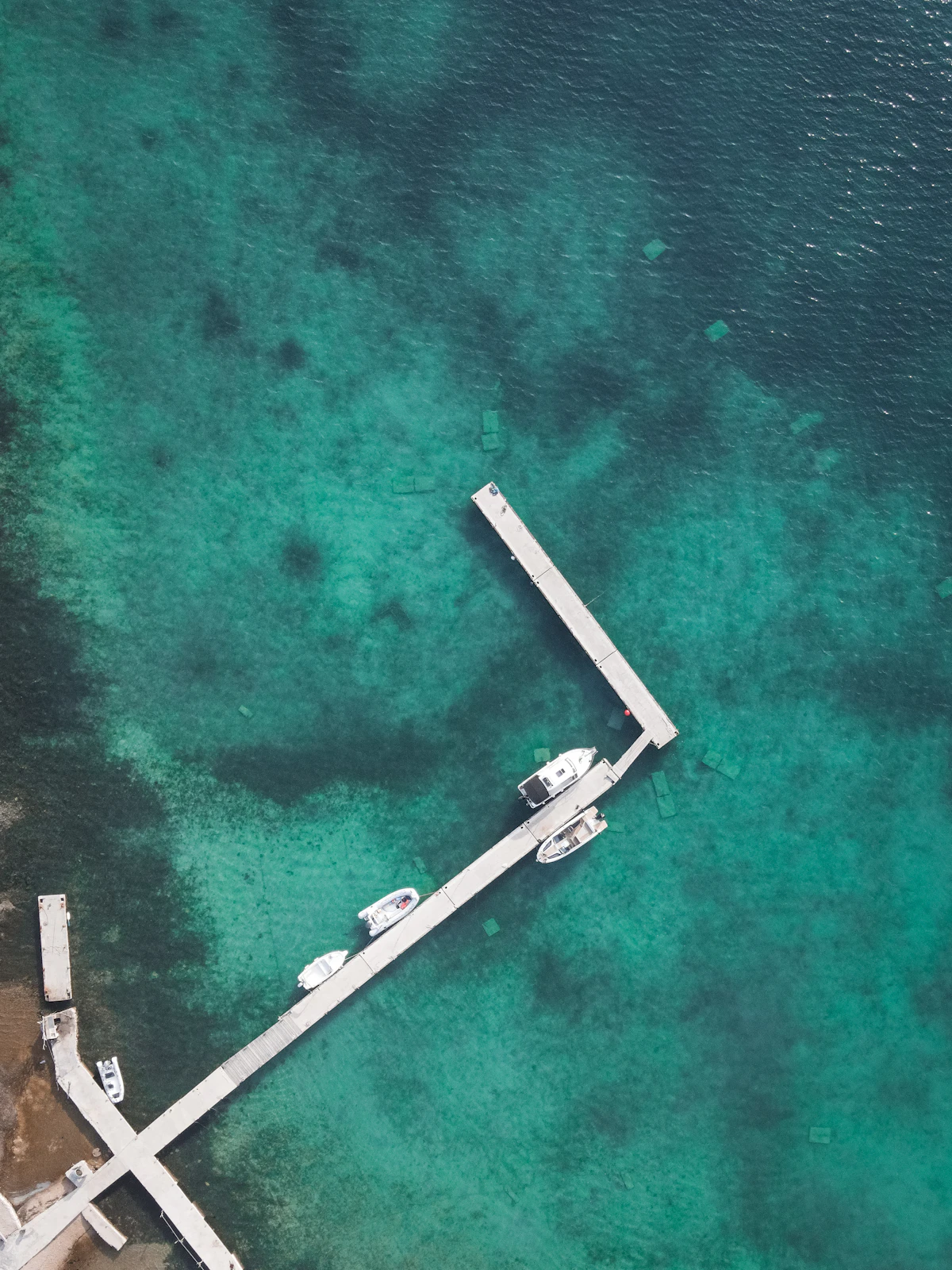 Aerial drone view of a wooden dock with entertaining deck