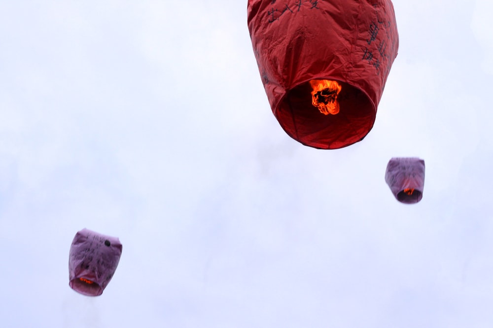 a group of hot air balloons floating in the sky