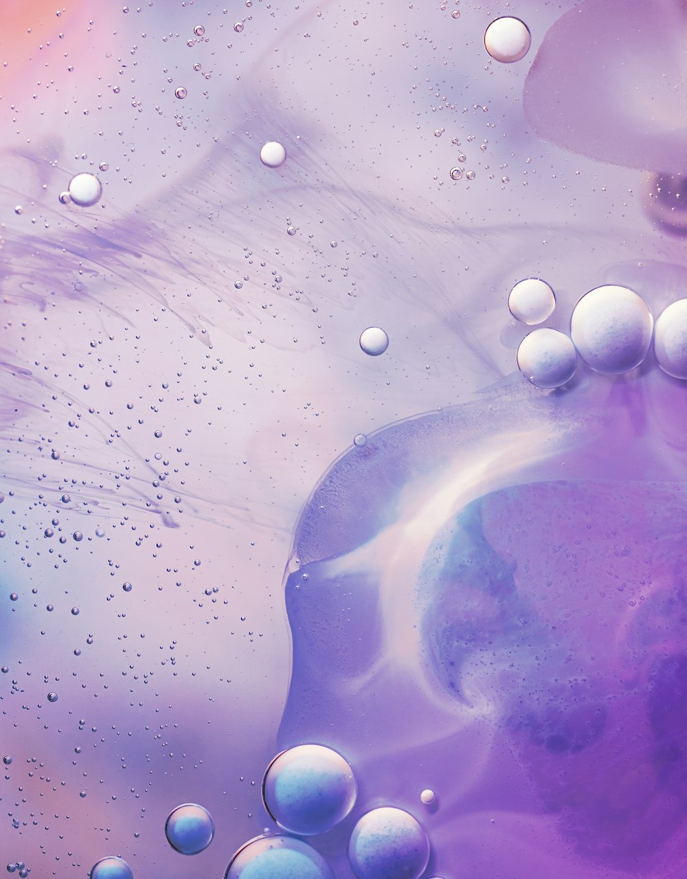 a close up of a purple liquid with bubbles