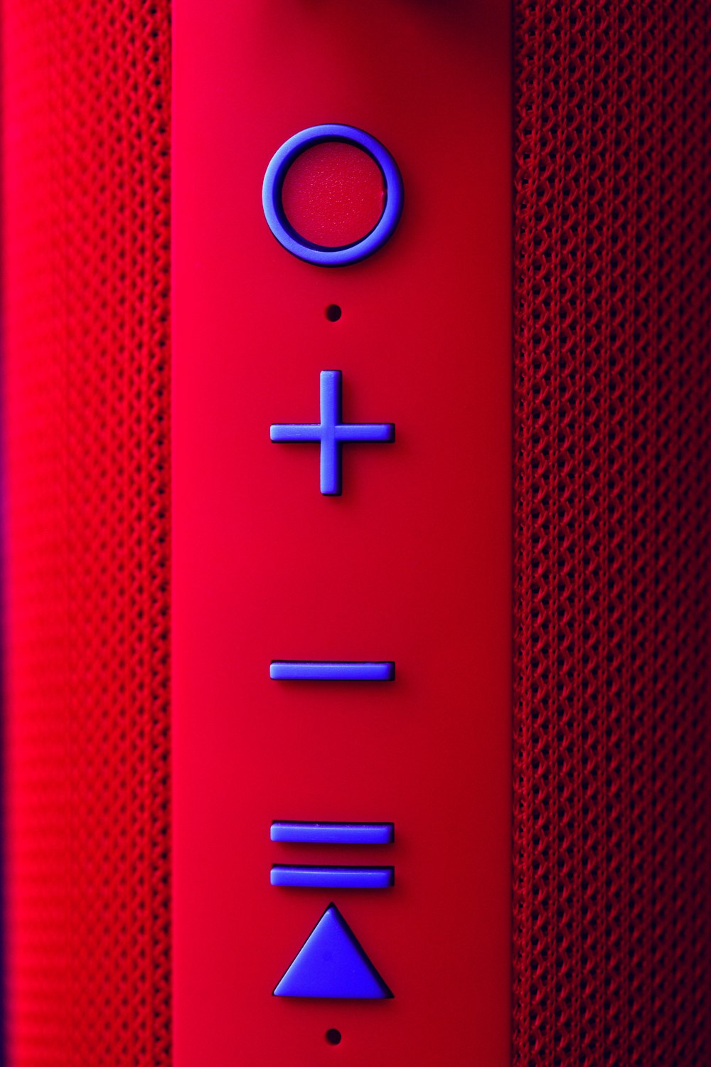 a close up of a button on a speaker