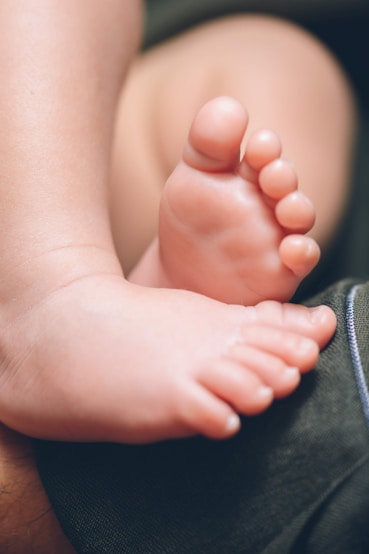 a close up of a baby's bare foot