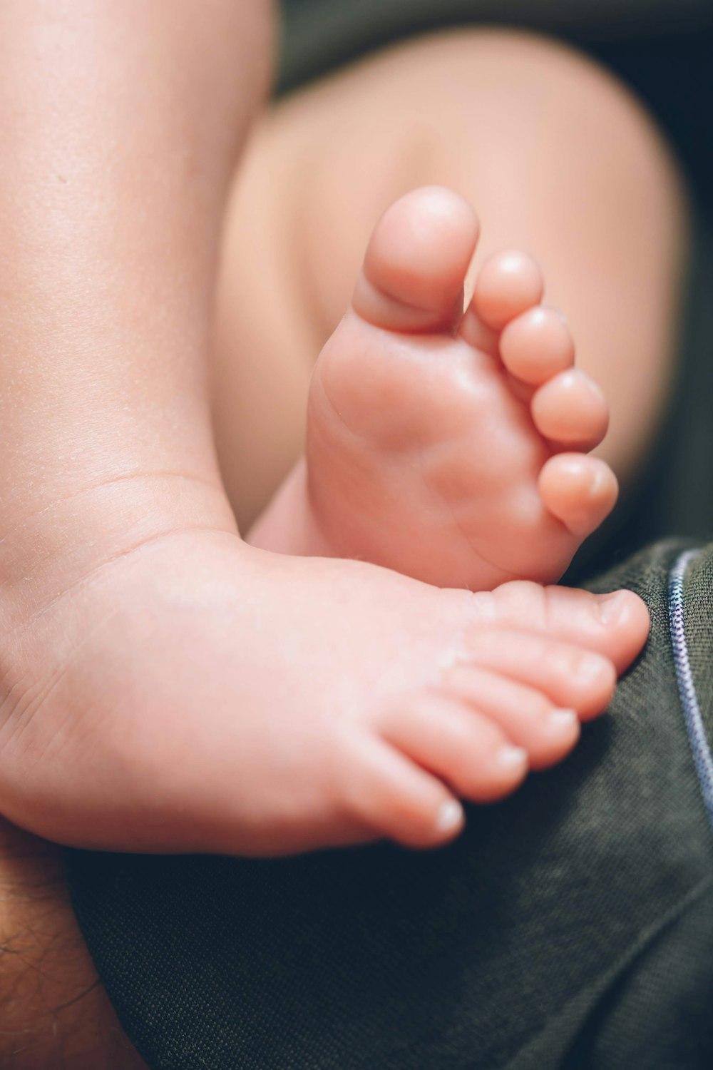 a close up of a baby's bare foot