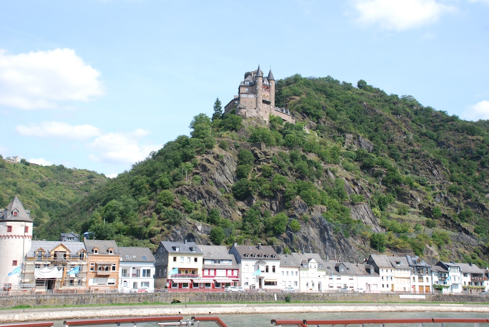 a castle on top of a mountain in a town